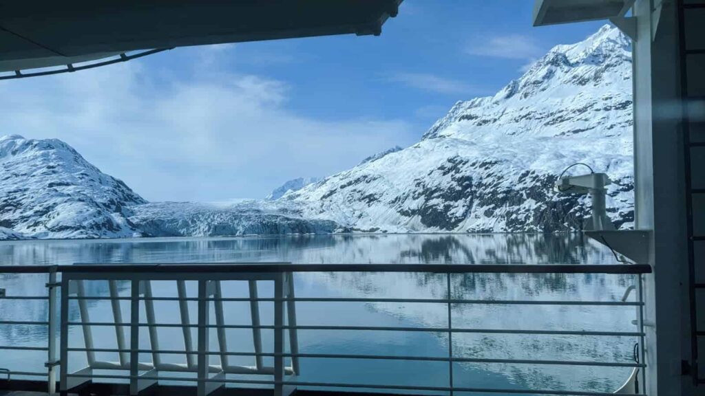 Alaska cruise ship sailing through glacier-lined waters