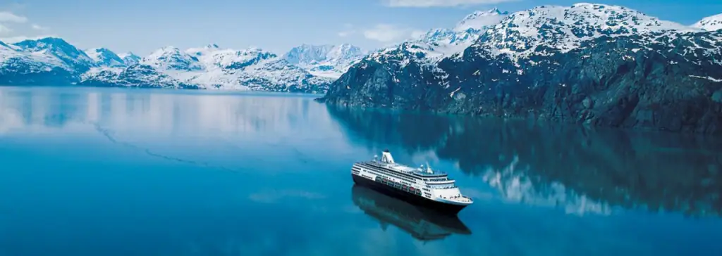 Cruise ship scenic sailing through Frederick Sound in Alaska surrounded by mountains