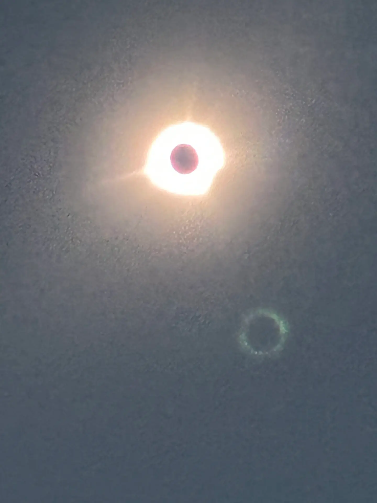 Solar eclipse seen through a filter from a cruise ship deck on April 8, 2024
