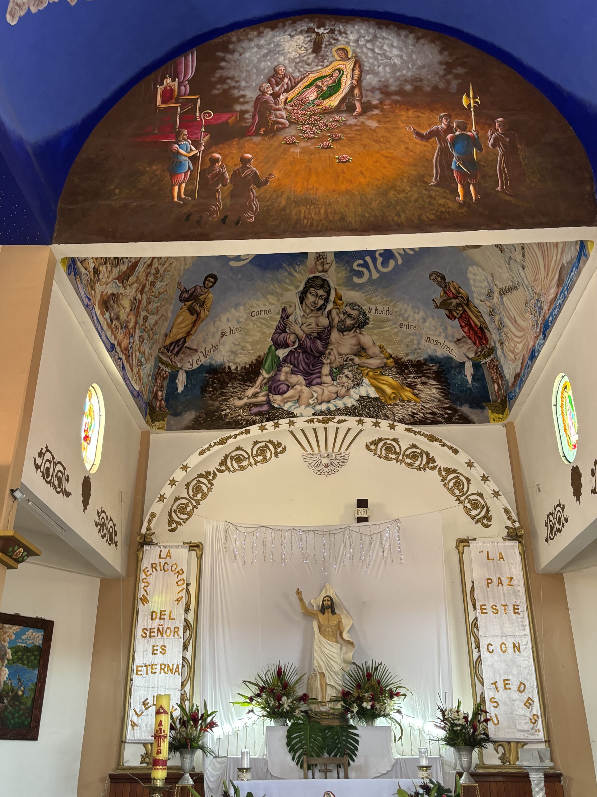 Painted murals and altar inside a Catholic church in Huatulco, Mexico